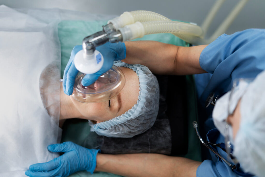 A woman is being treated by a doctor in a hospital.